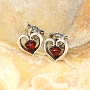 Sterling silver heart stud earrings with natural Baltic amber