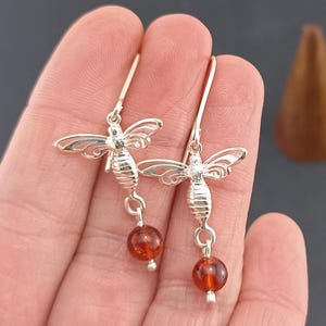 Sterling silver drop long earrings with natural Baltic amber