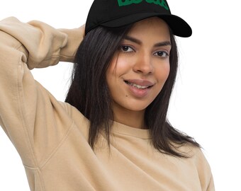 May include: Black baseball cap with the word "birds" embroidered in green across the front. The cap has a curved brim and a classic six-panel design. The cap is made of a soft, durable material.