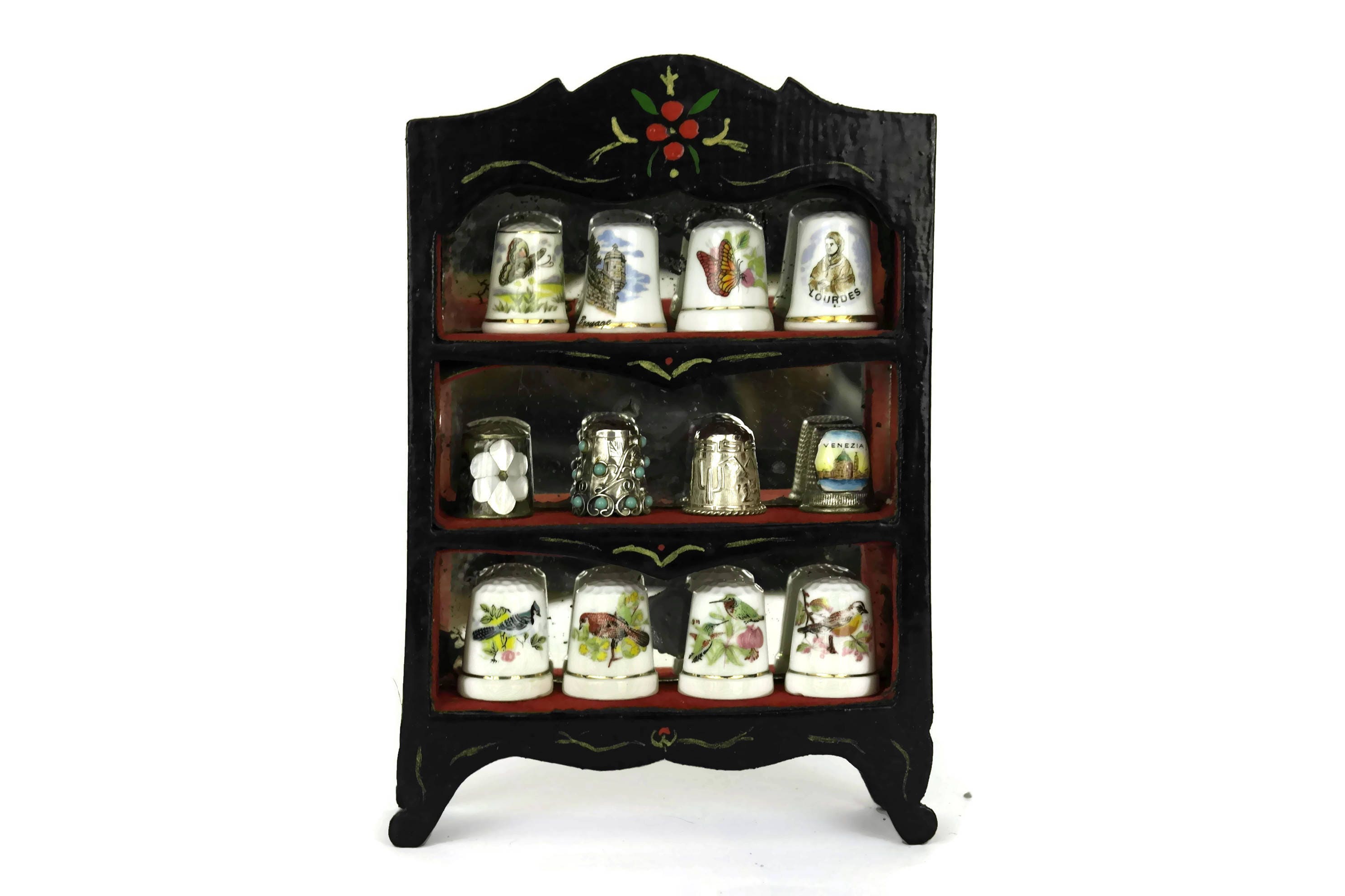 thimble collection in display case. vintage french porcelain and