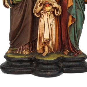 A Plaster Statue with Child Jesus, Saint Virgin Mary and Saint Joseph