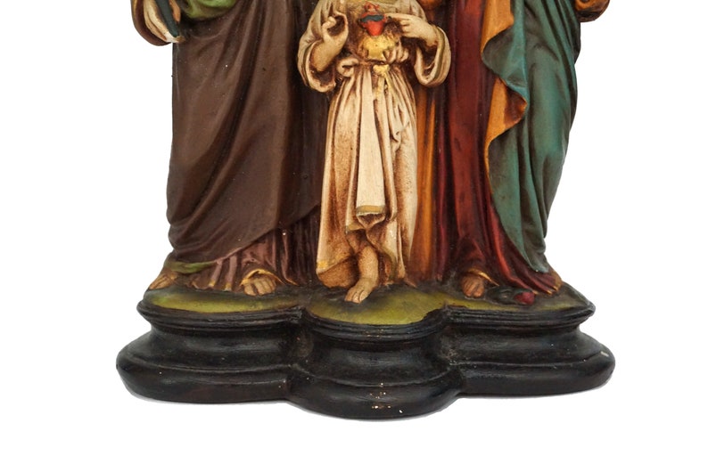 A Plaster Statue with Child Jesus, Saint Virgin Mary and Saint Joseph