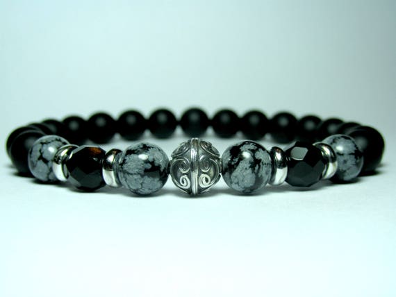 Bracciale Elastico Uomo Donna con Pietre dure naturali Ossidiana Fiocco di Neve e Onice da 8 mm con charm Teschio Bracciale Elastico Uomo Donna con Pietre dure naturali Ossidiana Fiocco di Neve e Onice da 8 mm con charm Teschio