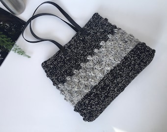 Black hand knitted tote bag with leather handles