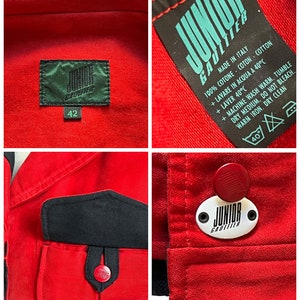 May include: Red denim jacket with black accents and a Junior Gaultier label. The jacket has a pocket with a button closure and a label with care instructions.
