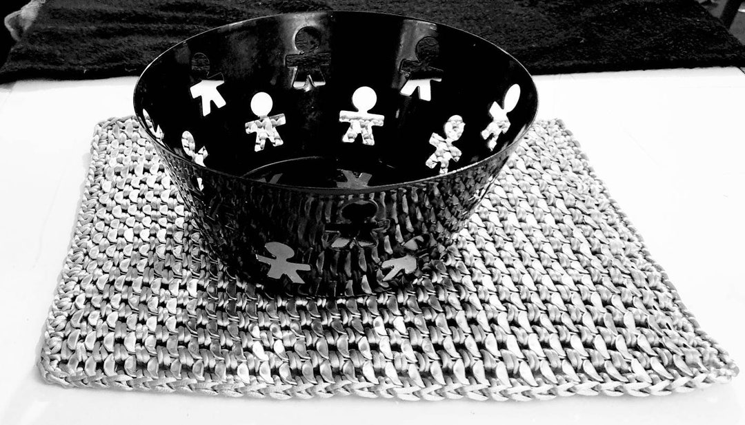 Recycled can ring pulls placemat.Poptabs. Silver colour. Retro. Hippy. Alternative.Steampunk and