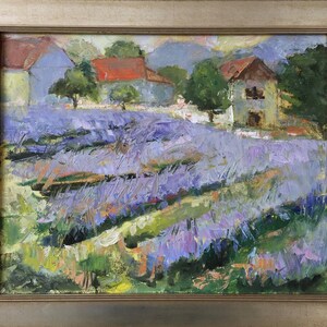 May include: A painting of a lavender field with two houses in the background. The houses are painted in shades of blue, red, and brown. The lavender field is painted in shades of purple, green, and yellow.