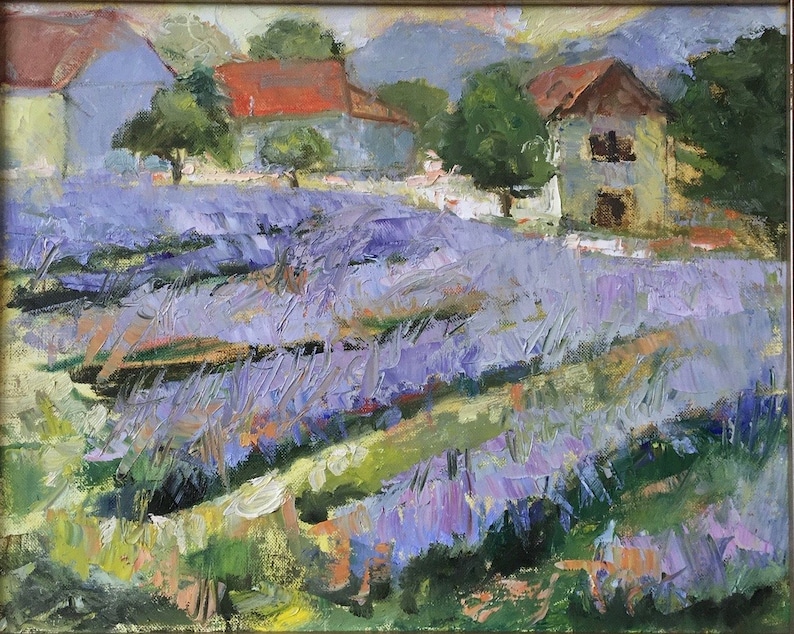May include: A painting of a lavender field with two houses in the background. The houses are painted in shades of blue and red, and the field is a vibrant purple.