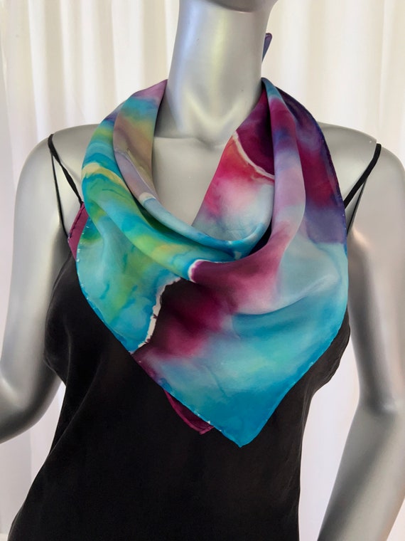 Small square silk scarf, abstract landscape design blues, purple, red.
