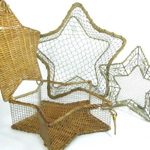 May include: Three star-shaped baskets made of woven wicker and wire mesh. The largest basket is made of wire mesh and has a woven wicker lid. The smallest basket is made of wire mesh with a decorative design.