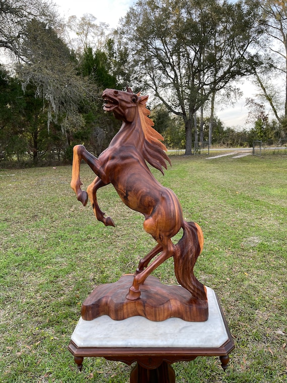 large wooden horse sculpture