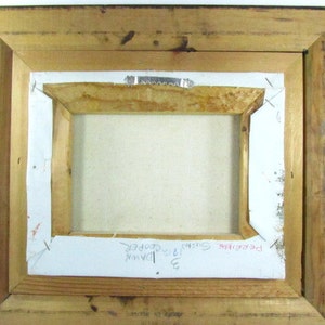 May include: The back of a framed painting with the text "Pebblebrook", "3 Sunrise", "1913", "Dawn", and "Ida Cooper" written on the back.