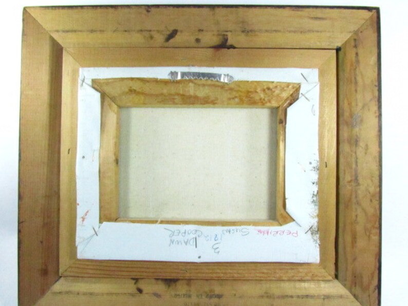 May include: The back of a framed painting with the text "Pebblebrook", "3 Sunrise", "1913", "Dawn", and "Ida Cooper" written on the back.