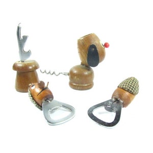 May include: A collection of wooden bottle openers and corkscrews. One opener is shaped like a dog with a red nose and black ear. Another has a mushroom-shaped base with a silver opener. The other two have a hat-shaped top.