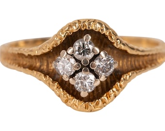 Anillo de diamantes de cuatro piedras de 18 quilates