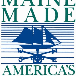 May include: A blue and white logo with the text "MAINE MADE" in green letters, a blue sailboat with a white compass rose, and the text "AMERICA'S BEST" in green letters with two red stars.