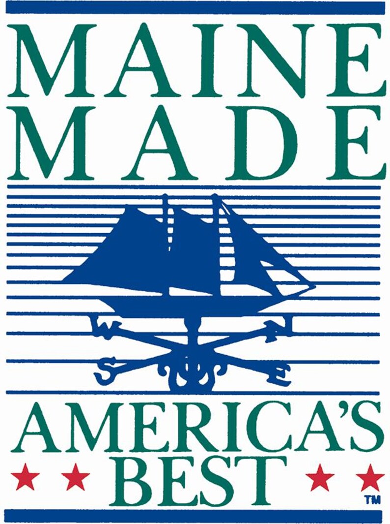 May include: A blue and white logo with the text "MAINE MADE" in green letters, a blue sailboat with a white compass rose, and the text "AMERICA'S BEST" in green letters with two red stars.