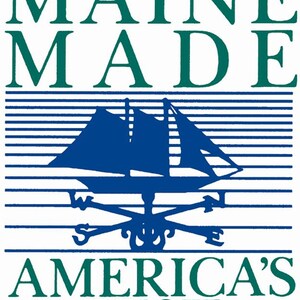 May include: A blue and white logo with the text "MAINE MADE" in green letters, a blue sailboat with a white compass rose, and the text "AMERICA'S BEST" in green letters with two red stars.