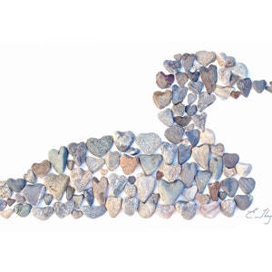 May include: A loon bird made out of small, heart-shaped stones in shades of gray, brown, and white. The stones are arranged to form the shape of a loon, with its head, beak, body, and wings clearly visible. The background is white.