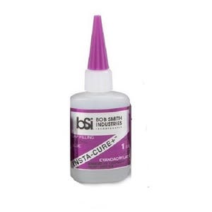 May include: A clear plastic bottle of Insta-Cure+ gap filling glue from Bob Smith Industries. The bottle has a purple cap and a label with the company logo and product information.