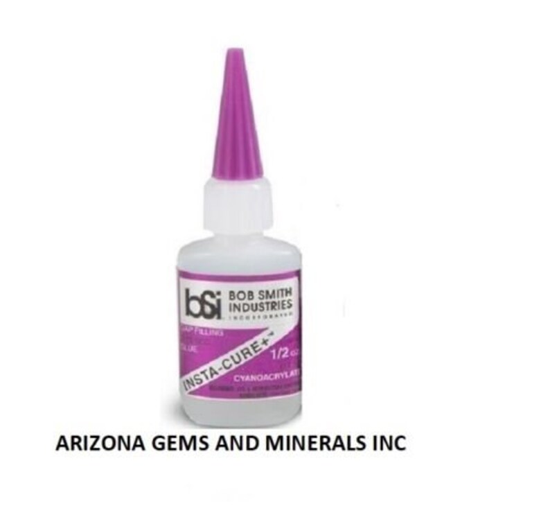 May include: A clear plastic bottle of Insta-Cure+ gap filling glue, a cyanoacrylate adhesive, from Bob Smith Industries. The bottle is 1/2 ounce and has a purple cap.