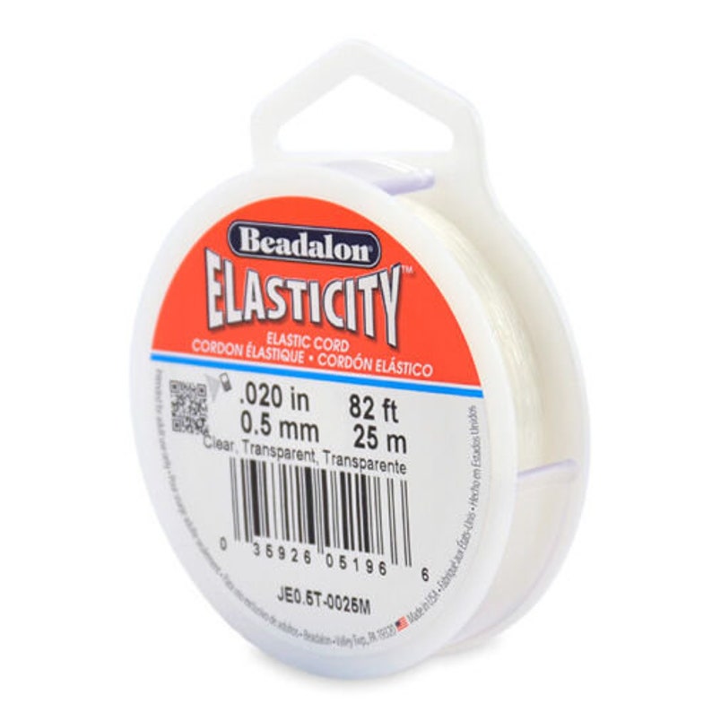 May include: A spool of clear elastic cord for jewelry making. The spool is labeled "Beadalon Elasticity Elastic Cord" and has the measurements 0.020 in (0.5 mm) and 82 ft (25 m).