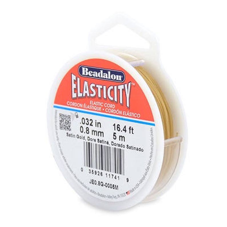 May include: A spool of gold-colored elastic cord, labeled "Beadalon Elasticity Elastic Cord" with the measurements 0.032 in, 0.8 mm, 16.4 ft, and 5 m.