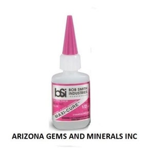 May include: A clear plastic bottle of Bob Smith Industries Maxi-Cure Extra Thick glue with a pink cap. The bottle is labeled with the brand name, product name, and size: 1/2 oz.