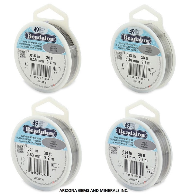 May include: Four spools of Beadalon bead stringing wire. Each spool is labeled with the wire's diameter in inches and millimeters, and the length in feet and meters. The wire is silver in color.
