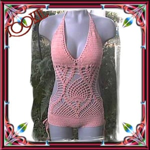 May include: A pink crocheted halter top swimsuit with a delicate, intricate design. The swimsuit has a low-cut neckline and a fitted silhouette.