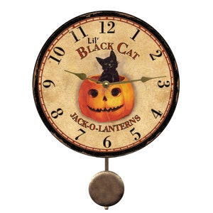 May include: A black cat sits inside a carved orange jack-o'-lantern with a black face and a toothy grin. The clock face is surrounded by a black frame with Roman numerals and the words "Lil' Black Cat" and "Jack-O-Lanterns".