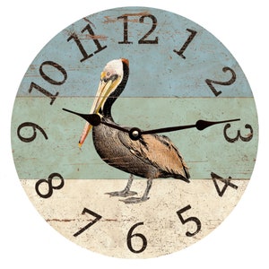 May include: A round wooden clock with a blue, green, and white striped background. A brown pelican with a long beak is in the center of the clock. The clock face has black Roman numeral hour markers and black hands.