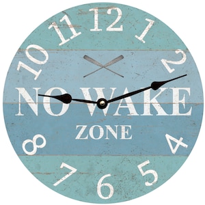 May include: A round wooden clock with a blue and green gradient background. The clock face has white numbers and a black clock hand. The text "NO WAKE ZONE" is printed in white on the clock face.