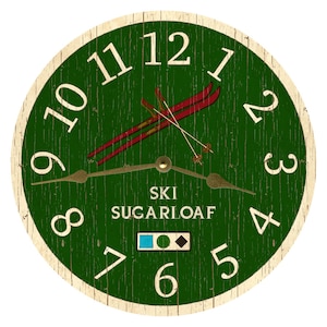 May include: Green wooden clock with white numbers and a red and white ski design. The clock face says "Ski Sugarloaf" with a blue, green, and black diamond symbol.