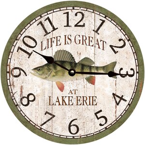 May include: A round, green-framed clock with a white face and black Roman numeral hour markers. The clock features a painted image of a fish with the text "Life is Great at Lake Erie".