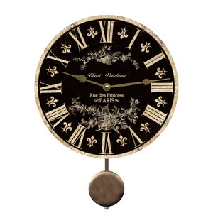 May include: Black and gold pendulum clock with Roman numeral markings and a floral design. The clock face reads "Henri Vendome Rue des Princess PARIS".