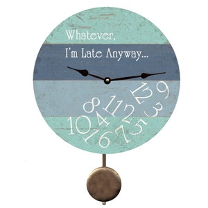 May include: A blue and green wooden pendulum clock with the text "Whatever, I'm Late Anyway..." on the face. The clock has white numbers and black hands.