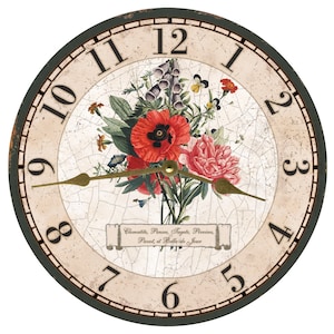 May include: A round, cream-colored clock face with black Roman numeral hour markers and black minute markers. The clock face has a distressed, cracked finish and features a bouquet of colorful flowers in the center. The text "Clematite, Pensee, Tagetes, Pivoine, Pavot, et Belle-de-Jour" is printed on a scroll at the bottom of the clock face. The clock face is surrounded by a dark green wooden frame.