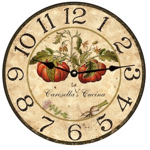 May include: A round, cream-colored clock with black Roman numeral hour markers and black hands. The clock face features a vintage-style illustration of tomatoes on a vine, with the text "Carosello's Cucina" below.