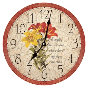 May include: A round, red-rimmed clock with a white face and black hands. The clock face features a floral design with lilies in shades of yellow and orange. The clock face also includes the text "To everything there is a season, And a time to every purpose under heaven."