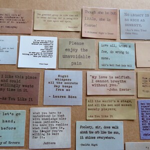 May include: A collection of small, rectangular cards with quotes in a typewriter font. The cards are in various colors, including tan, brown, and gray. The quotes are from famous authors and plays.