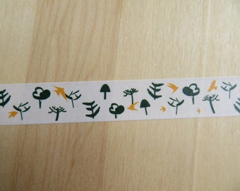 May include: A white washi tape roll with a repeating pattern of dark green trees, yellow accents, and small birds. The tape is designed for crafts, scrapbooking, or adding decorative touches to various projects.