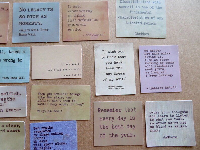 May include: A collection of square cards with quotes from famous authors. The cards are in various colors, including blue, beige, and pink, with black text. The quotes cover themes of honesty, dreams, and self-reflection.