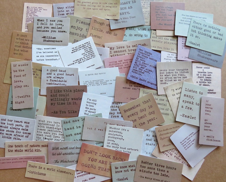 May include: A collection of vintage-style quote cards with various quotes from famous authors. The cards are in different colors and sizes, with text in a typewriter font. The overall theme is literary and inspirational.