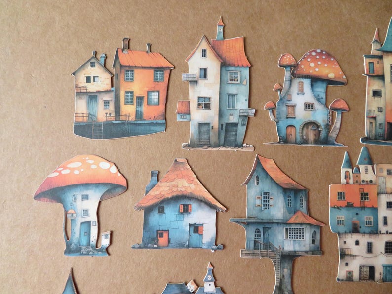 May include: A collection of whimsical paper cutouts of houses and mushroom-shaped dwellings. The houses feature orange, blue, and beige color schemes with detailed architectural elements. The mushroom houses have orange and white spotted caps.