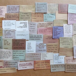 May include: A collection of small, rectangular cards with quotes in various fonts and colors. The cards feature quotes from famous authors and historical figures, perfect for journaling or scrapbooking.