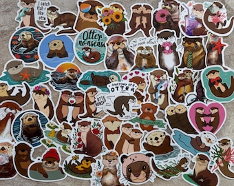 May include: A collection of colorful otter stickers with various designs. Some stickers feature otters with flowers, donuts, and sunglasses. Text includes "Otter nonsense," "Anatomy of a Otter," and "I catch fish like otte."