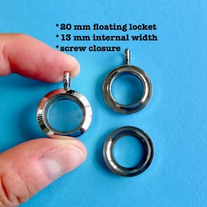 May include: Three silver-colored, round floating lockets with screw closures. The lockets are 20 mm in diameter with a 13 mm internal width. The text on the image reads: *20 mm floating locket *13 mm internal width *screw closure.