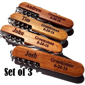 May include: Set of three wooden pocket knives with personalized names and the text "Groomsman 6-24-16" engraved on each.