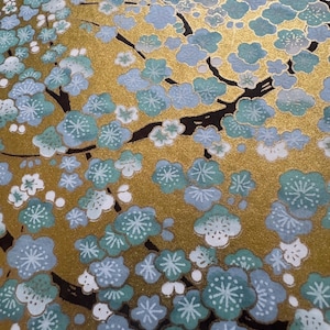 Origami paper, Chiyogami  paper, Yuzen paper, Washi paper.  Light blue plum on Gold floral pattern.